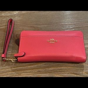 Coach wallet with zipper and change pocket.